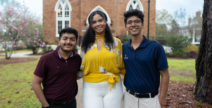 Three University of South Alabama Honor College students, from left, Suhas Patil, Kaitlyn Riggins and Dev Mehta, recently took third, second and first place in a competition for research posters at the Alabama Academy of Science Conference.